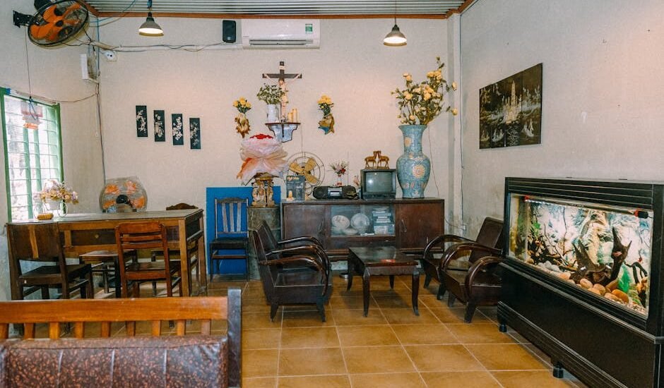 A cozy room featuring an aquarium stand with a fish tank and wooden furniture, relevant to choosing the right aquarium cabinet stand.
