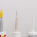 Three tubes of silicone sealant, relevant for removing old silicone from aquariums.