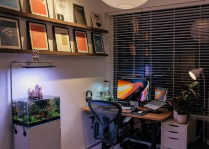 A home office featuring a planted aquarium and workspace, relevant to using root tabs.