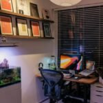 A home office featuring a planted aquarium with a CO2 bubble counter setup.