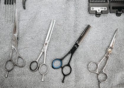Scissors and grooming tools laid out on a towel for disinfecting aquarium tools.
